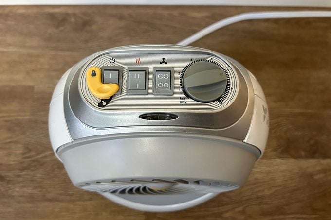 space heater top view with yellow button