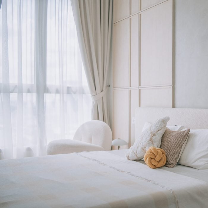 brightly lit bedroom beside window