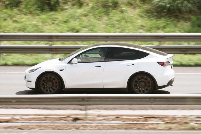 Tesla Model Y driving on a highway